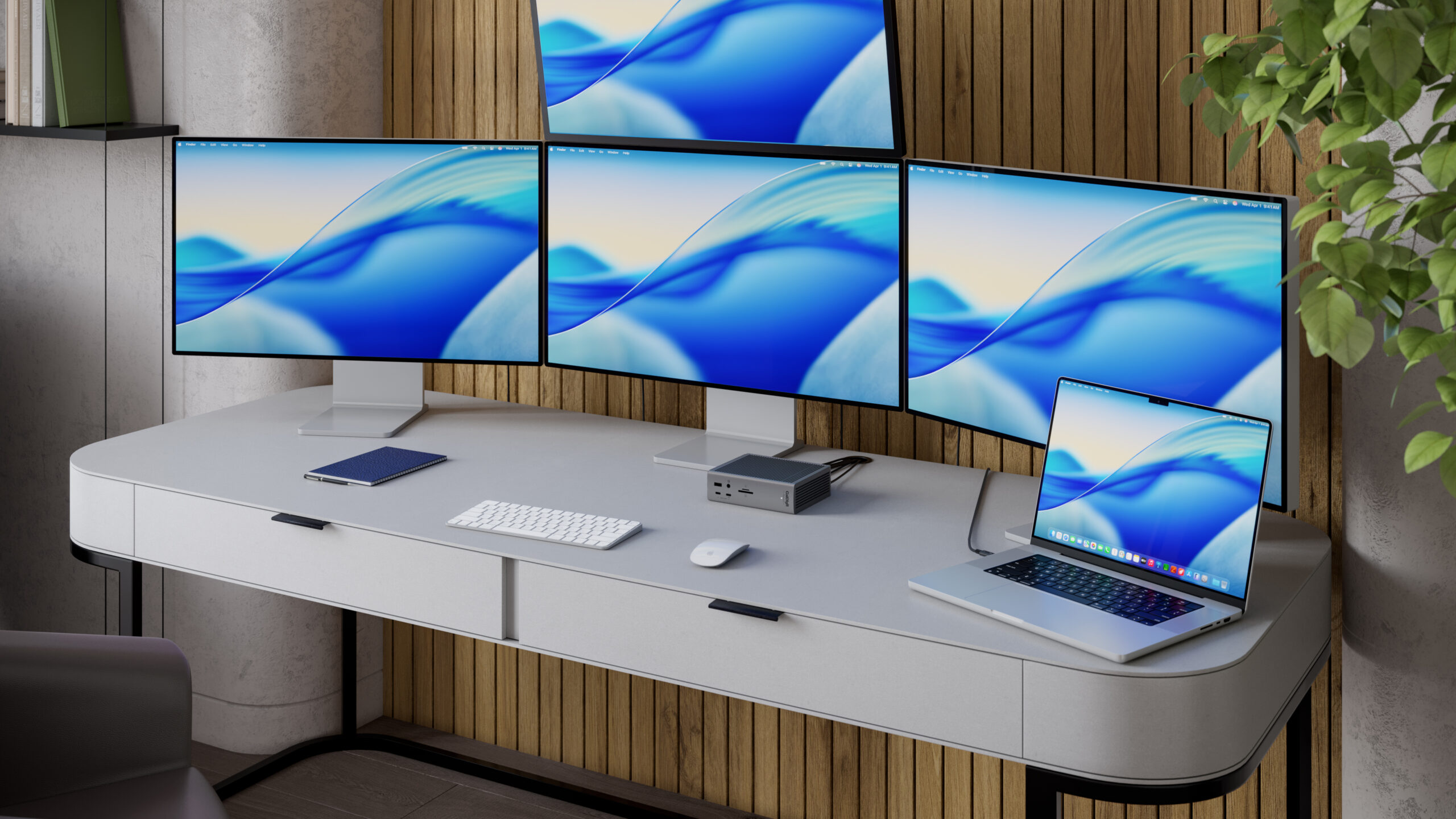 An image of the TS5 Plus on a desk connected to a MacBook Pro and 4 displays.