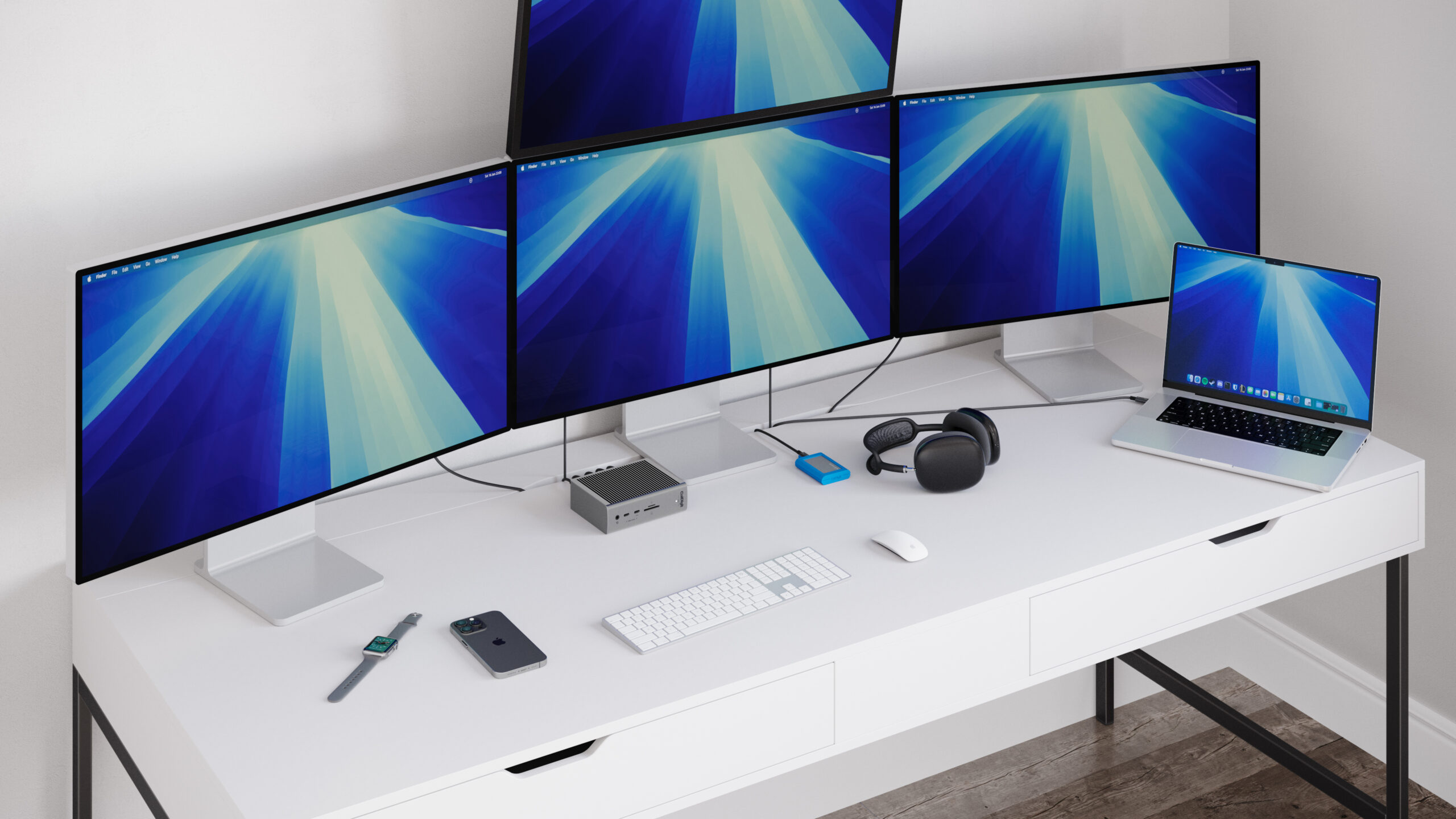 An image of the TS5 on a desk connected to a MacBook Pro and 4 displays.