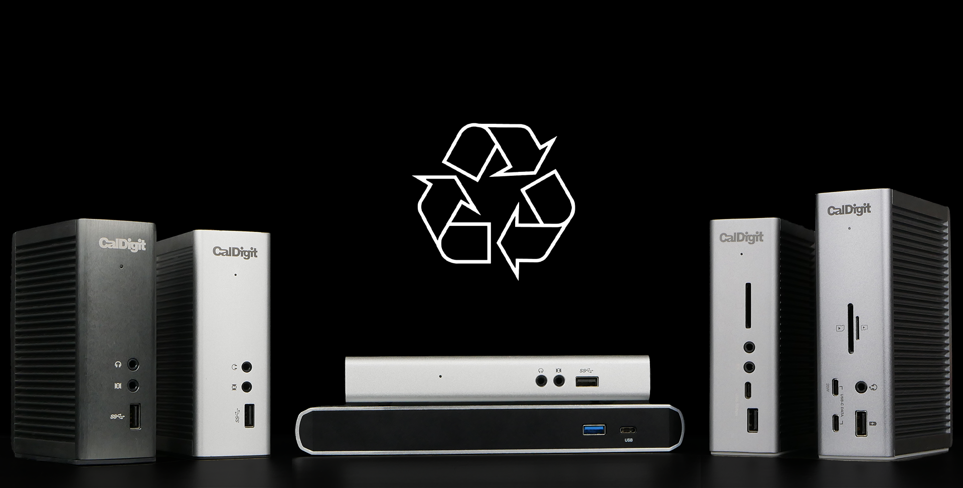 CalDigit products on a black table with a black background. Above them is a graphic of the Recycle logo.